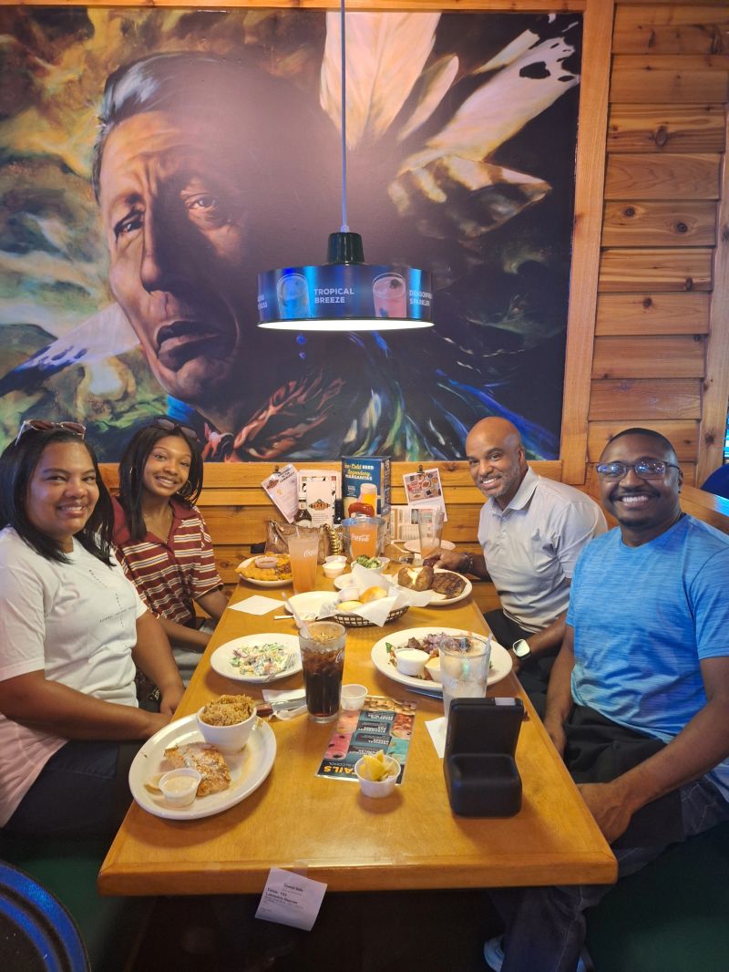 Bristan Heaven sharing a meal with friends and clients