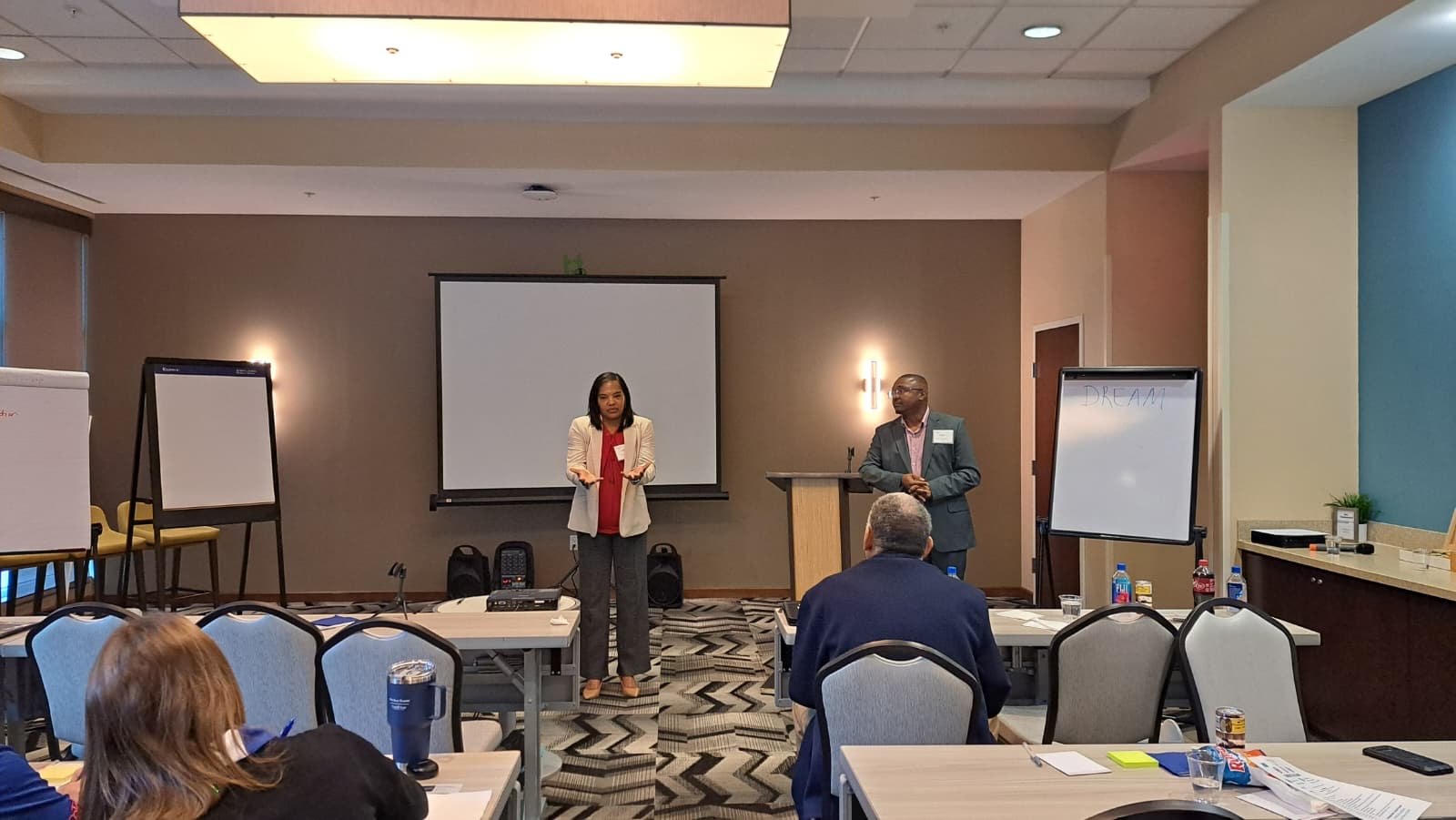 Latondra Heaven presenting with Bristan Heaven to a room of business leaders