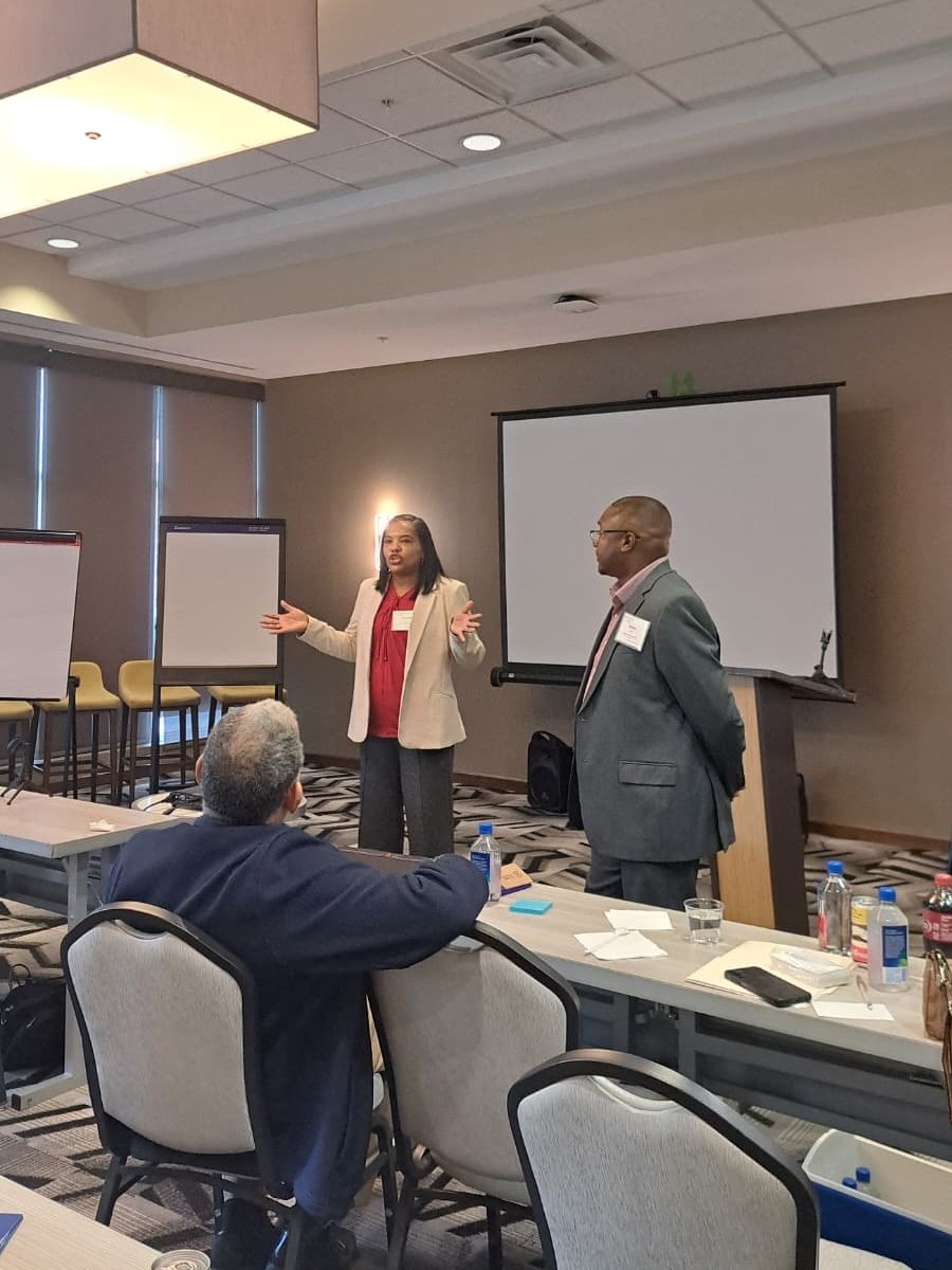 Latondra and Bristan Heaven giving strategic guidance to a participant